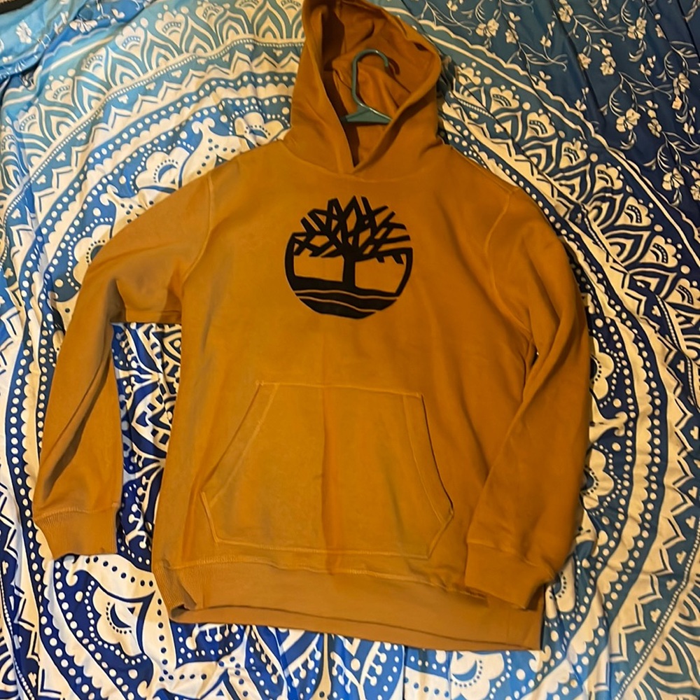 Timberland size xl fits a woman’s medium as I wore it once.